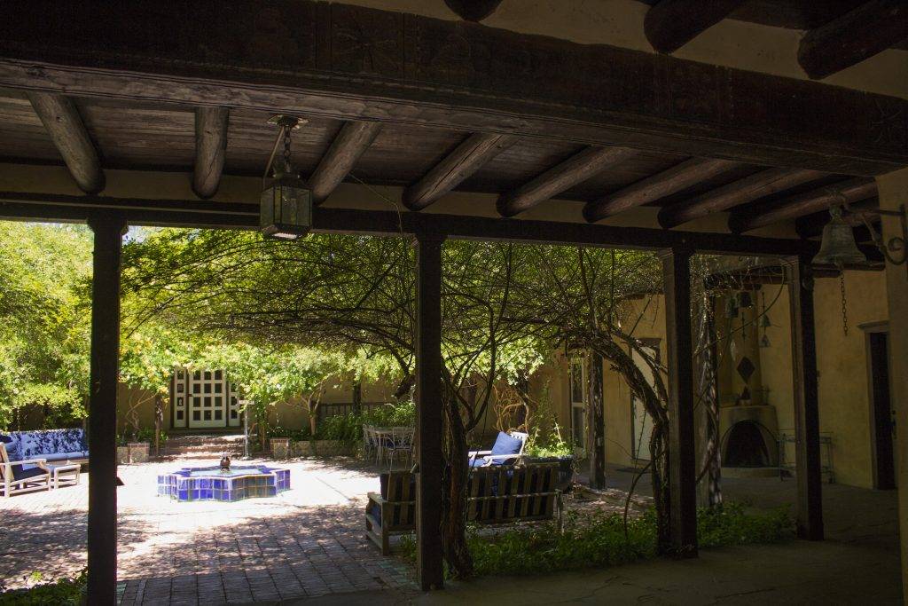 The wrap around portal offers shade in summer and features a fireplace for colder seasons.